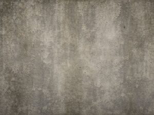 グレーの塗装が色褪せたコンクリート壁